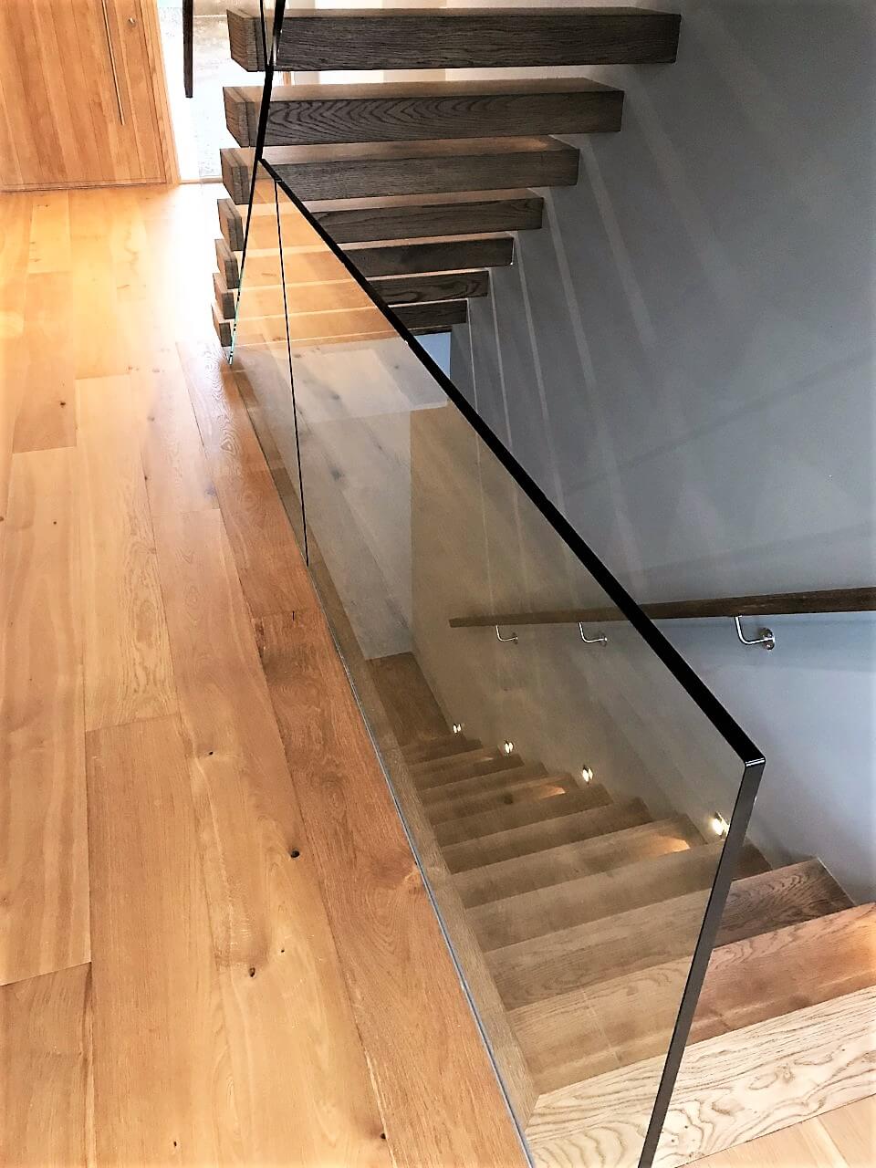 Dark oak floating stairs with glass balustrade Stairs Ireland